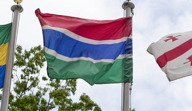 The flag of the Islamic Republic of the Gambia (centre) flying at United Nations headquarters in New York.