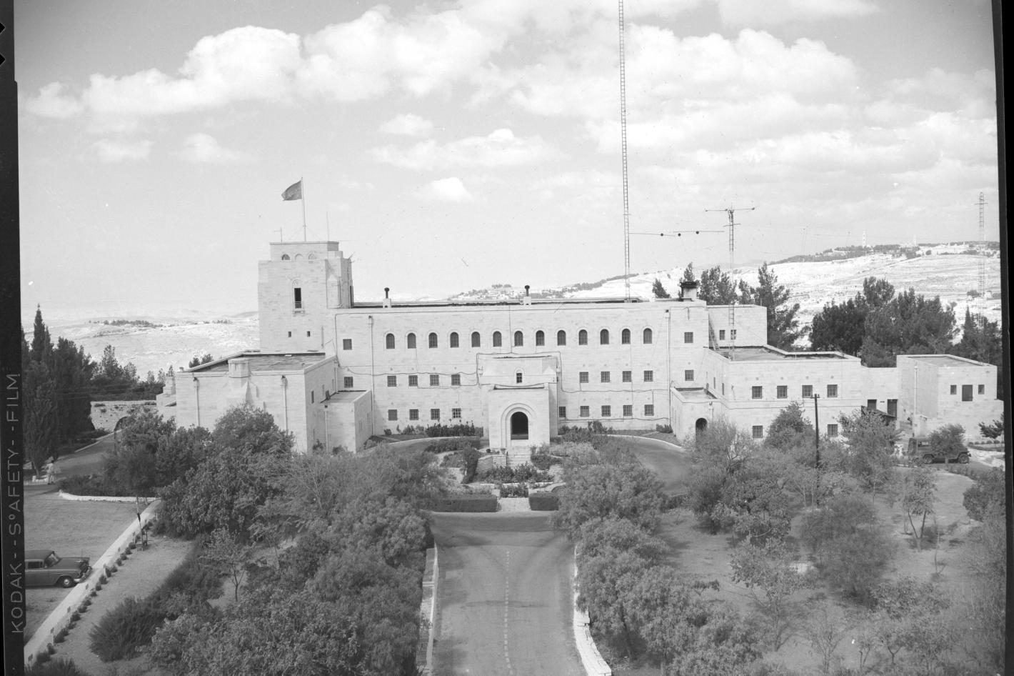 A black and white photo of a large white buidling