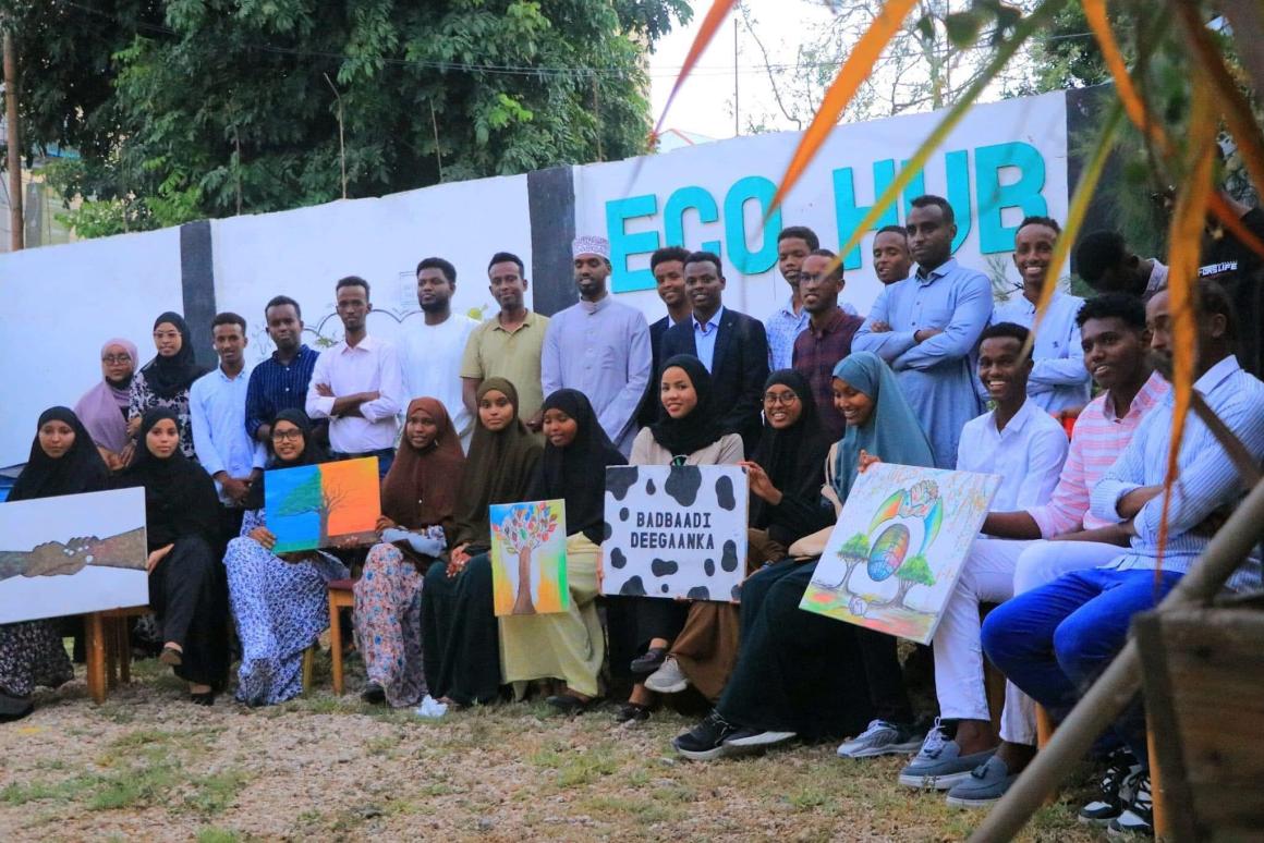 Abdishakur Abdirahman poses with a group of people in front of Eco Hub